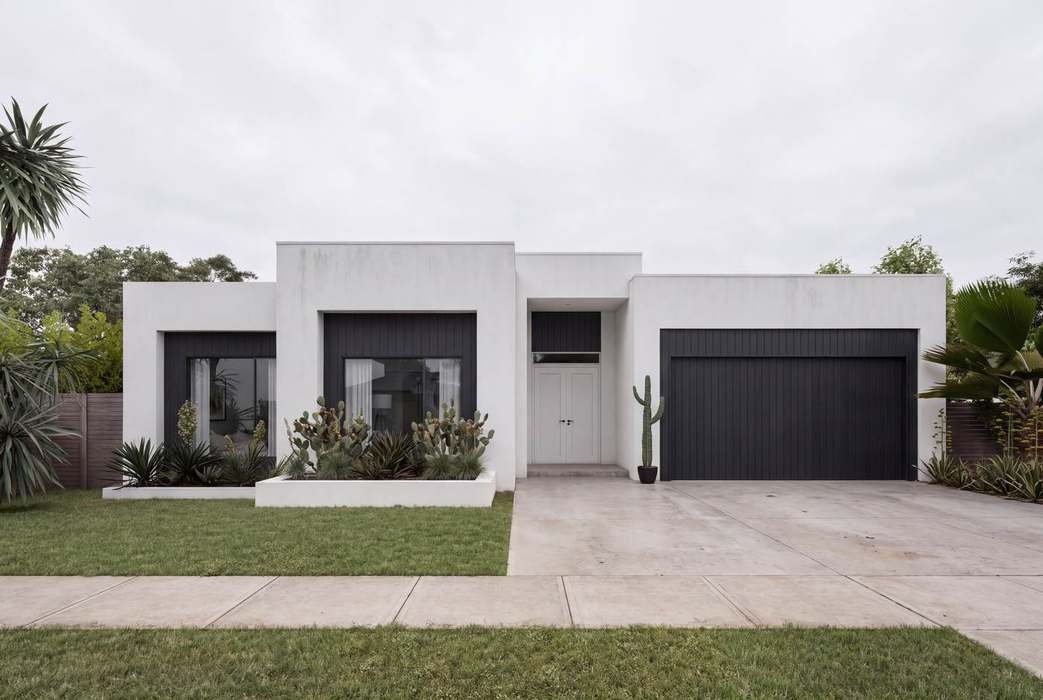 Single-storey house facade, black cladding